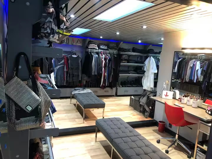 Dressing room with full-length mirror, clothing storage, bench and makeup station